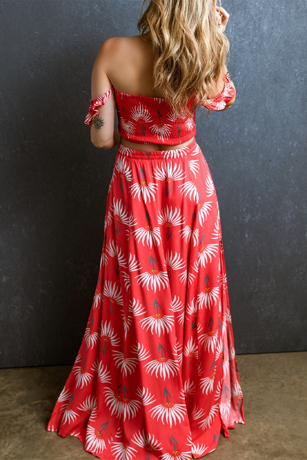 The image is showcasing a Bohemian Floral Shirred Off Shoulder Crop Top and Slit Maxi Skirt Set at Mommy & Lino's Closet