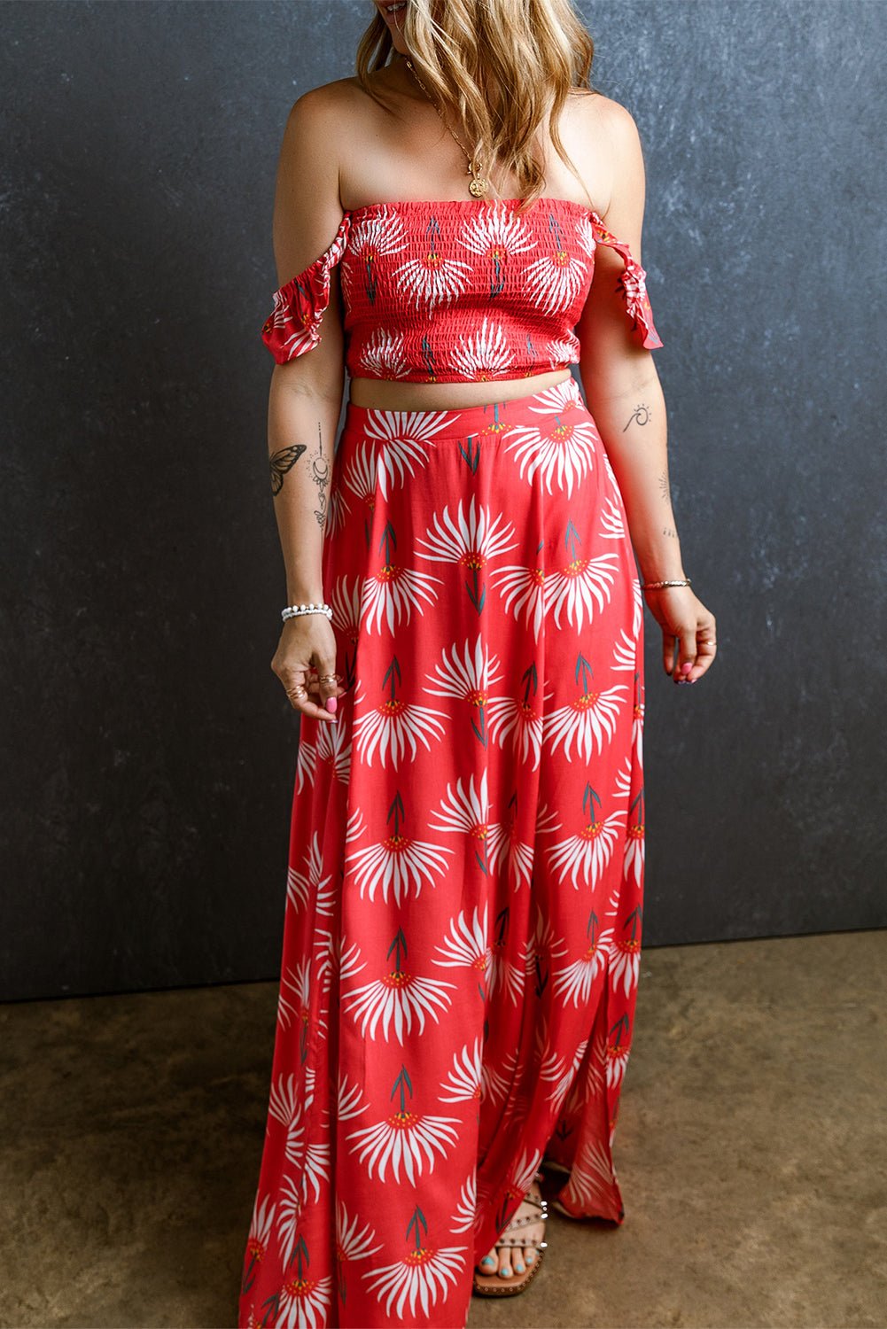 The image is showcasing a Bohemian Floral Shirred Off Shoulder Crop Top and Slit Maxi Skirt Set at Mommy & Lino's Closet
