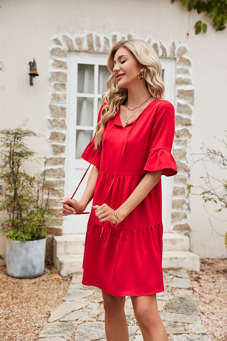 The image is showcasing a Ruffle Trim Tie Neck Flounce Sleeve Tiered Mini Dress Women Casual Half Sleeve Knee length Dress at Mommy & Lino's Closet