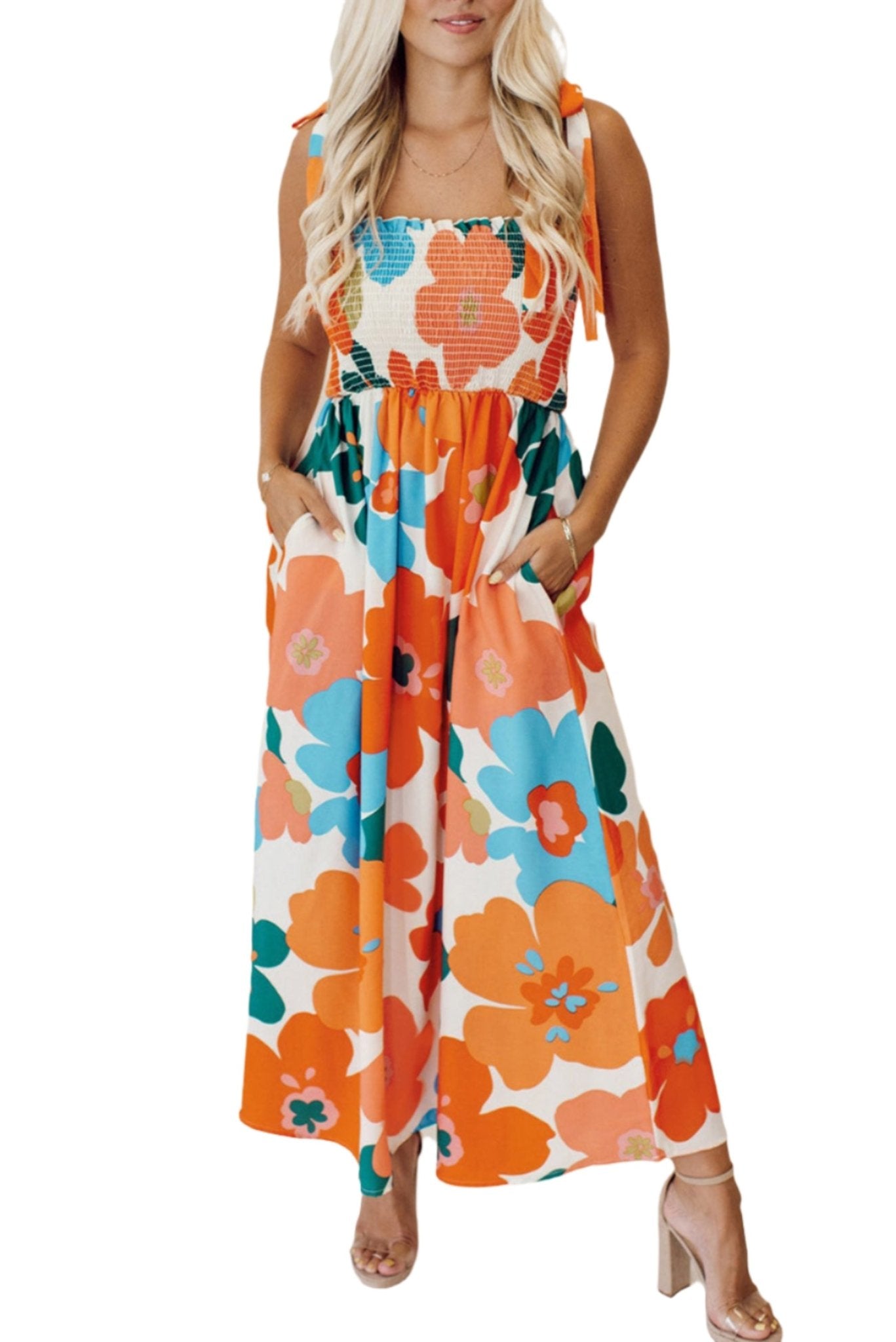 The image is showcasing a Women Floral Self Tied Straps Smocked Bust Maxi Dress With Pockets at Mommy & Lino's Closet