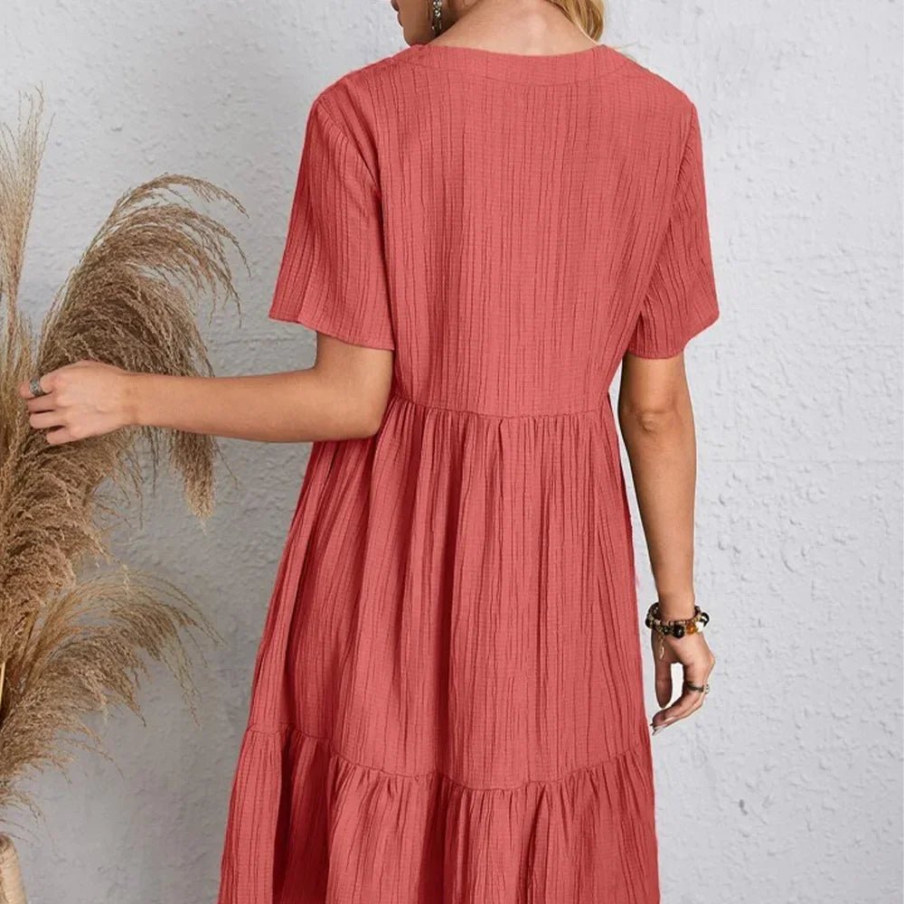 The image is showcasing a Women's Summer Casual V Neck Ruffle Mini Dress Short Sleeve A Line Bohemian Short Summer Dress Beach Sundress at Mommy & Lino's Closet